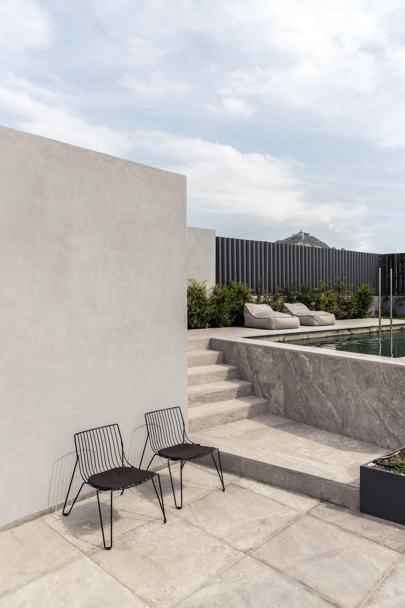 Perianth Hotel Athen Eksteriør billede Exterior wall and pool tiles